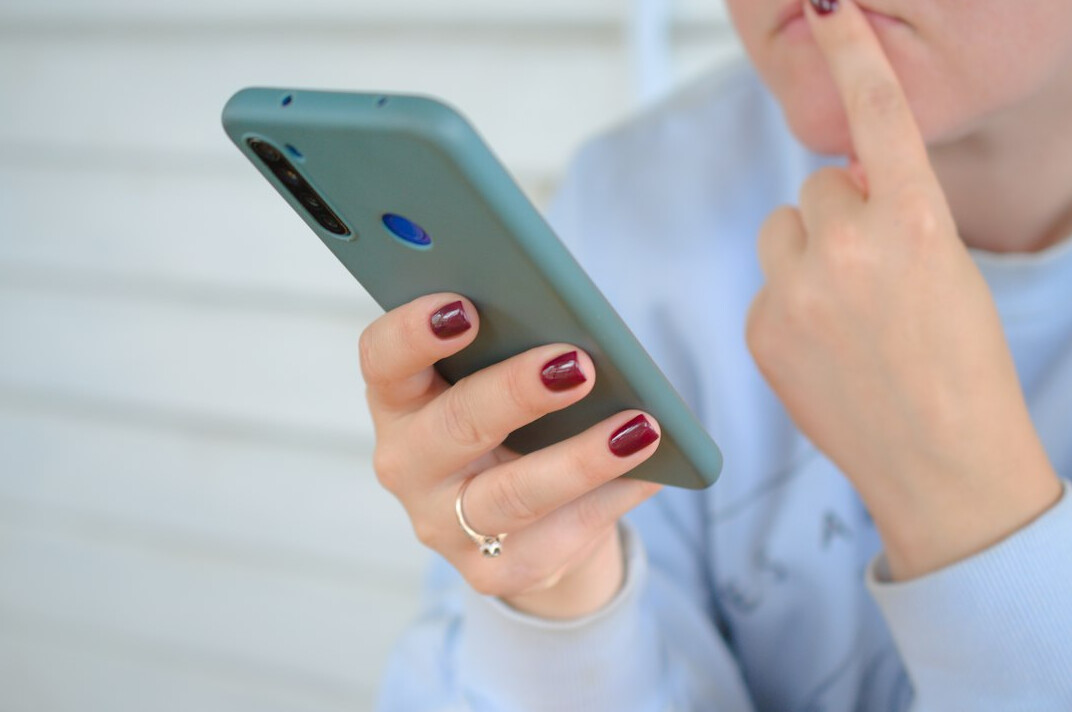 person using smartphone for insurance app