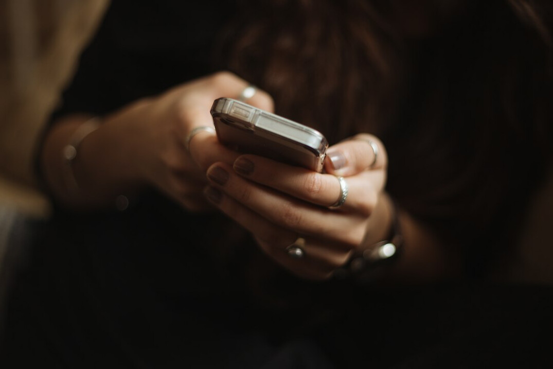 person using smartphone for insurance app