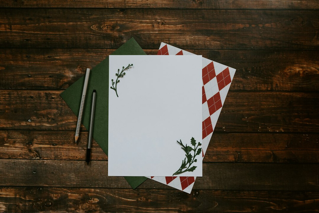 Printed documents and a pen on a desk